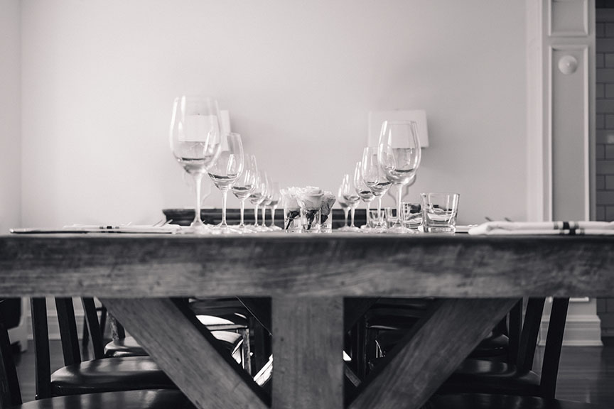 Long wood table with cutlery at the Apartment